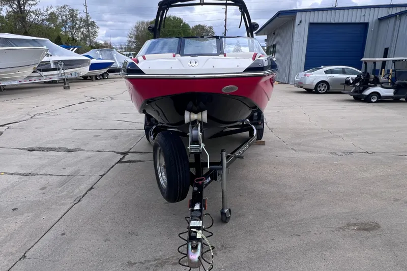 Slide: The Image of 2014 Scarab 195 H.O. boat on trailer in marina, front view. - 6