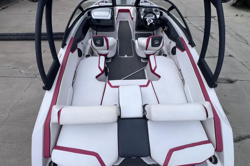 Slide: The Image of 2014 Scarab 195 H.O. boat interior with white and red seating, sleek design. - 7