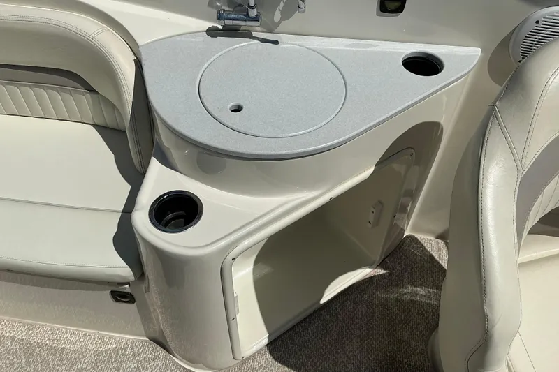 Slide: The Image of Interior of 2010 Stingray 250 LR boat featuring seating and storage area. - 7