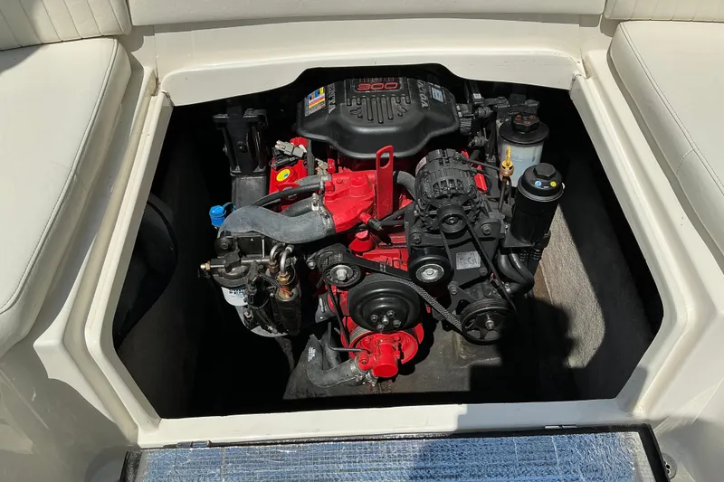 Slide: The Image of Engine compartment of a 2010 Stingray 250 LR boat, showcasing detailed mechanical components. - 8