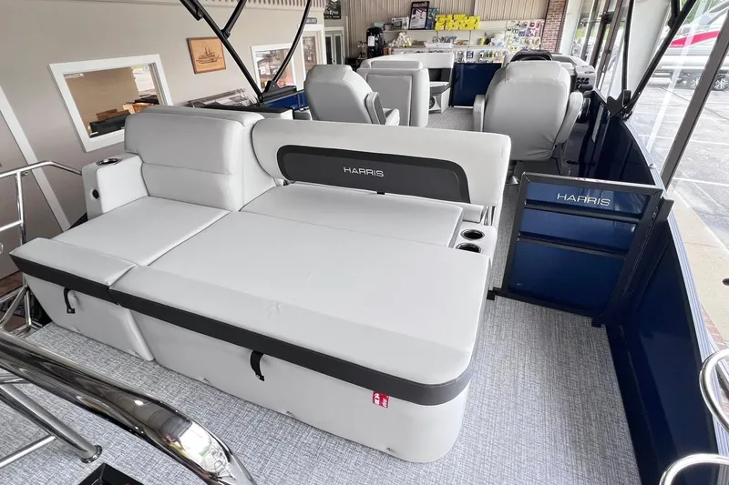 Slide: The Image of 2026 Harris Cruiser 210 SLDH pontoon boat interior with plush seating and modern design. - 10