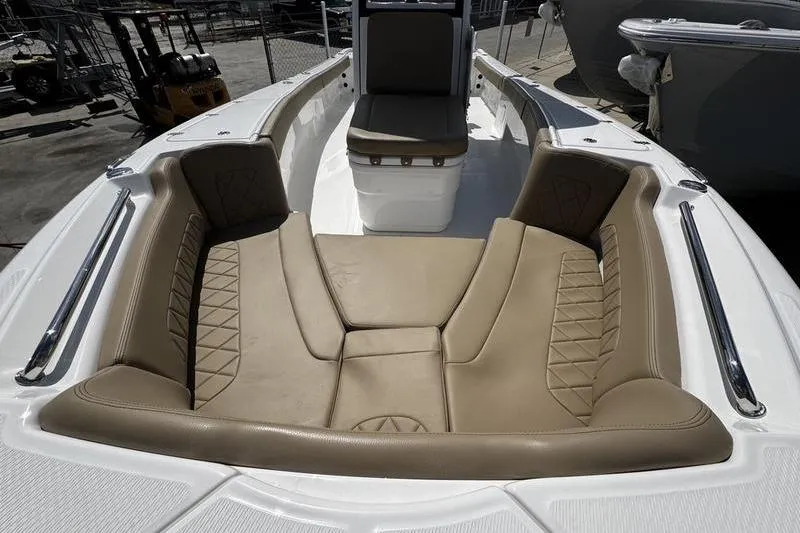 Slide: The Image of 2026 Blazer Bay Makaira 2800 boat interior with tan cushioned seating. - 11