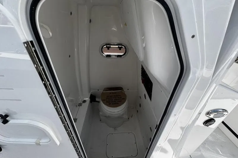 Slide: The Image of 2026 Blazer Bay Makaira 2800 boat interior with compact marine toilet. - 19