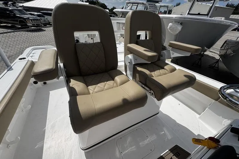 Slide: The Image of 2026 Blazer Bay Makaira 2800 boat seats with beige upholstery and armrests. - 21