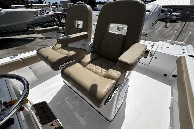 Slide: The Image of 2026 Blazer Bay Makaira 2800 boat with luxurious beige seating and armrests. - 24
