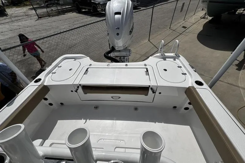 Slide: The Image of 2026 Blazer Bay Makaira 2800 boat deck with motor and storage compartments. - 25
