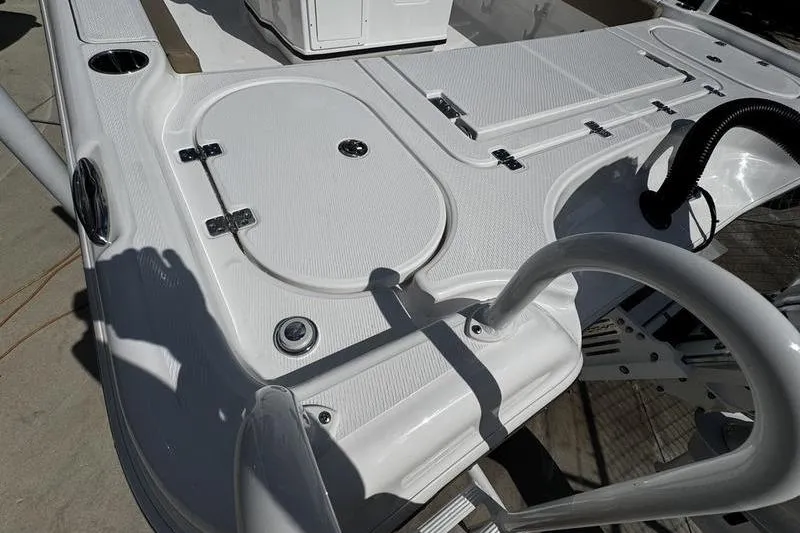 Slide: The Image of 2026 Blazer Bay Makaira 2800 boat deck with storage compartments and sleek design. - 26