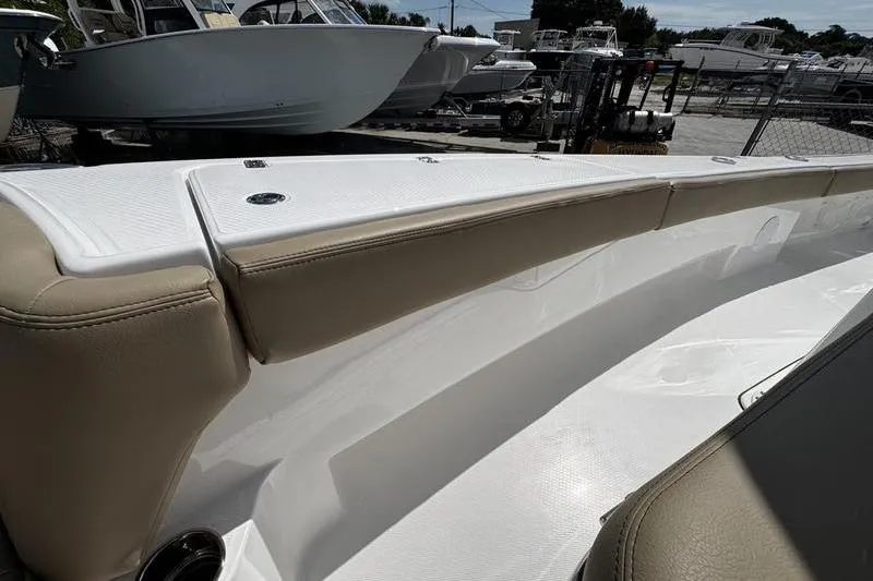 Slide: The Image of 2026 Blazer Bay Makaira 2800 boat interior with beige seating and white deck. - 27
