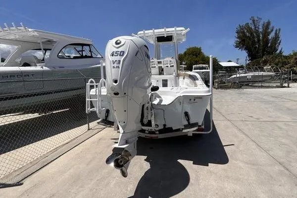 Slide: The Image of 2026 Blazer Bay Makaira 2800 boat with powerful 450 HP engine, docked outdoors. - 3