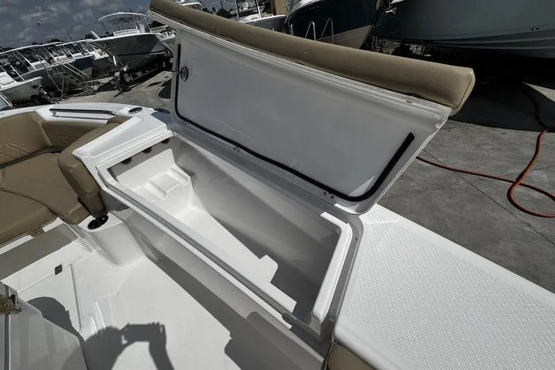 Slide: The Image of 2026 Blazer Bay Makaira 2800 boat storage compartment open, showcasing spacious interior. - 5