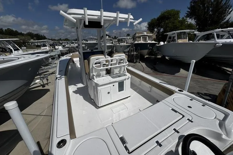 Slide: The Image of 2026 Blazer Bay Makaira 2800 boat, sleek design, docked under clear skies. - 9