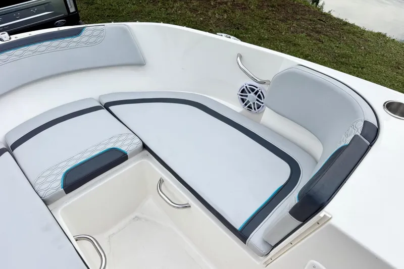Slide: The Image of 2022 Bayliner Element M17 boat interior with cushioned seating and speaker. - 10