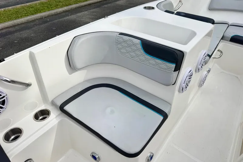 Slide: The Image of 2022 Bayliner Element M17 boat interior with cushioned seating and cup holders. - 15