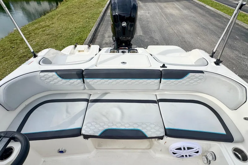 Slide: The Image of 2022 Bayliner Element M17 boat interior with cushioned seating and modern design. - 16
