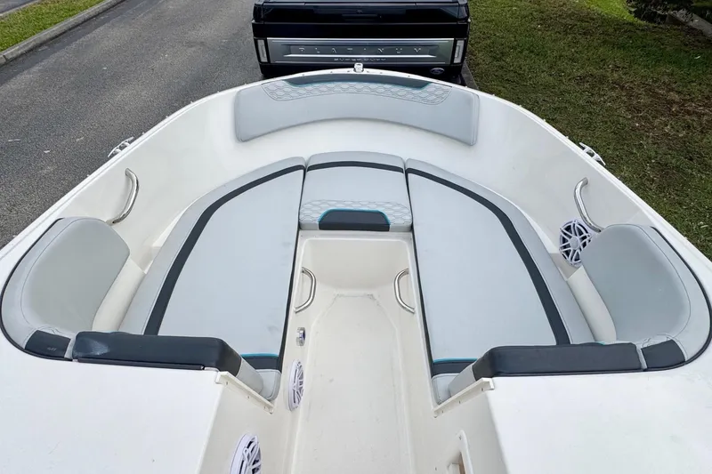 Slide: The Image of 2022 Bayliner Element M17 boat interior with spacious seating and modern design. - 8