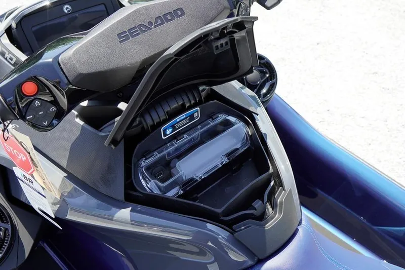 Slide: The Image of 2026 Sea-Doo GTX 170 storage compartment open, showcasing interior features and controls. - 15
