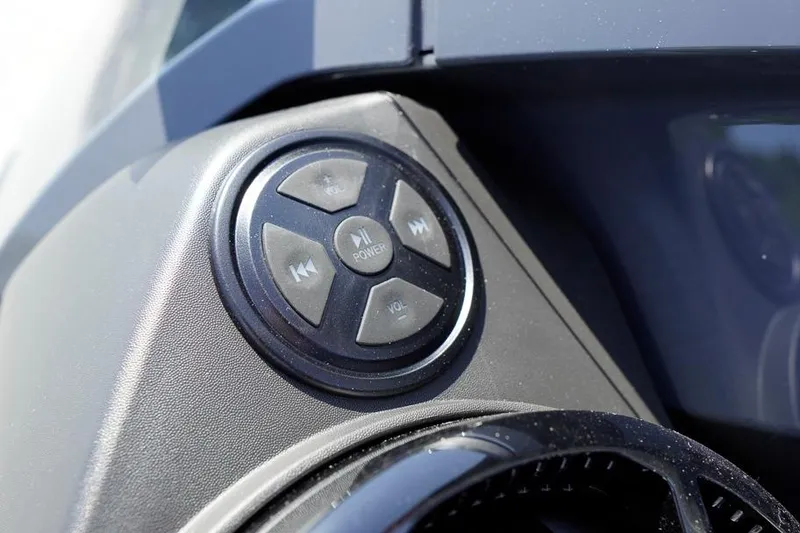 Slide: The Image of Close-up of 2026 Sea-Doo GTX 170 audio control panel with power and volume buttons. - 17