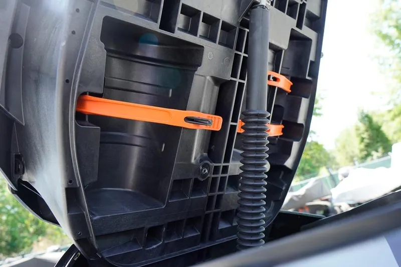 Slide: The Image of 2026 Sea-Doo GTX 170 storage compartment with orange straps and black tubing. - 23