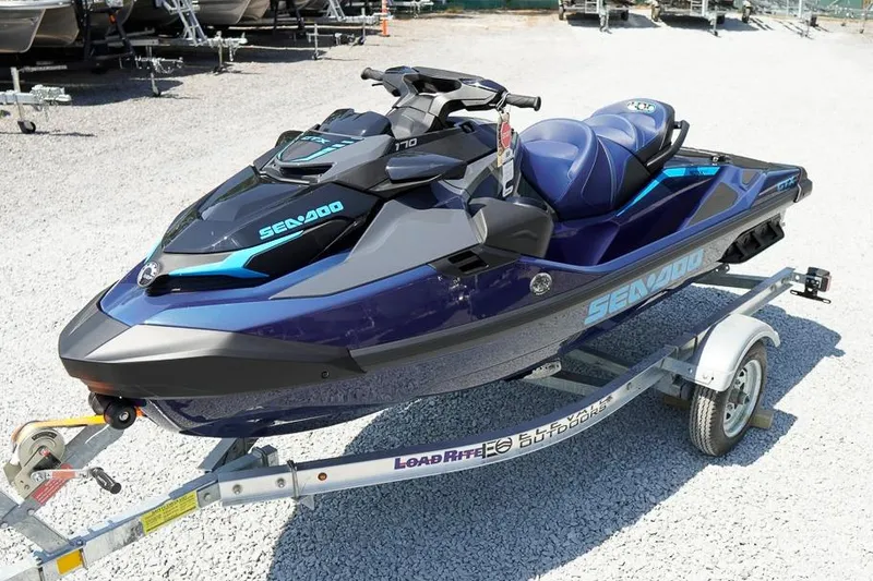 Slide: The Image of 2026 Sea-Doo GTX 170 jet ski on trailer, parked on gravel surface. - 3