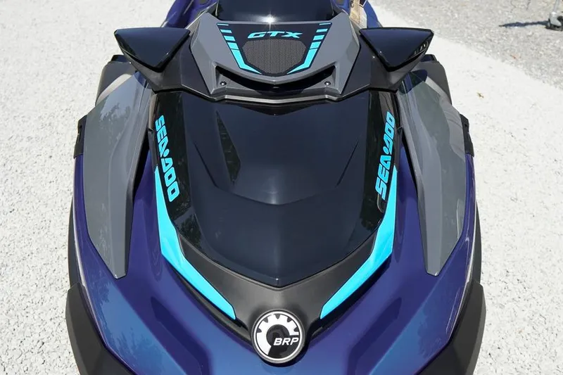 Slide: The Image of 2026 Sea-Doo GTX 170 jet ski, sleek design with blue accents on a gravel surface. - 4