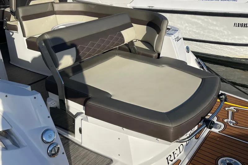 Slide: The Image of 2019 Monterey 295 Sport Yacht seating area with luxurious upholstery and sleek design. - 12