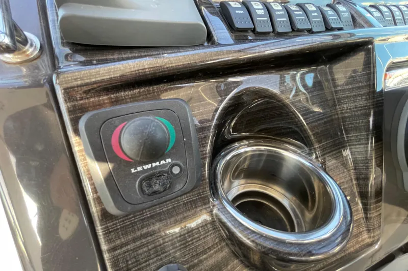 Slide: The Image of Control panel of 2019 Monterey 295 Sport Yacht with Lewmar knob and cup holder. - 18