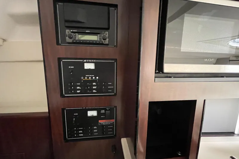 Slide: The Image of Control panel and microwave in 2019 Monterey 295 Sport Yacht interior. - 34