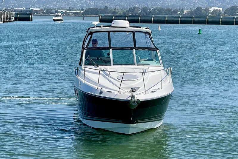 Slide: The Image of 2019 Monterey 295 Sport Yacht cruising on calm waters. - 8