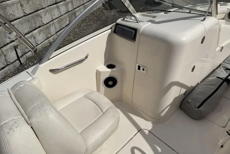 Slide: The Image of 2019 Grady-White Freedom 215 boat interior with seating and storage compartments. - 12