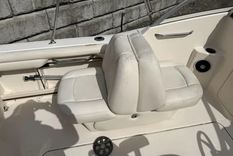 Slide: The Image of 2019 Grady-White Freedom 215 boat interior with white seating and stainless steel accents. - 13