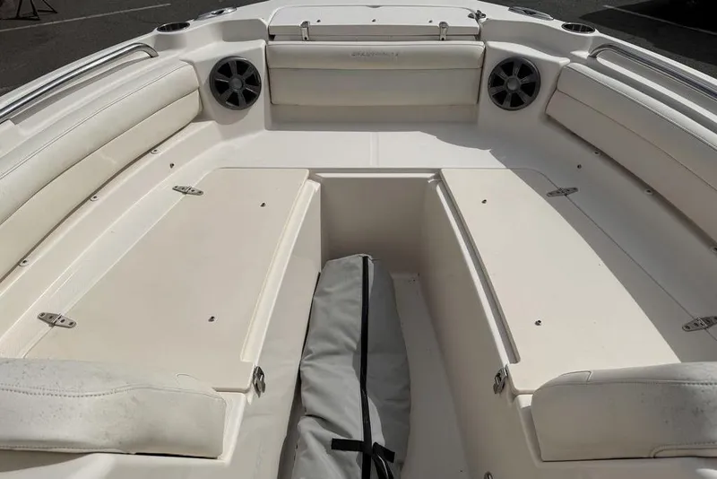 Slide: The Image of 2019 Grady-White Freedom 215 boat interior with seating and storage compartments. - 16