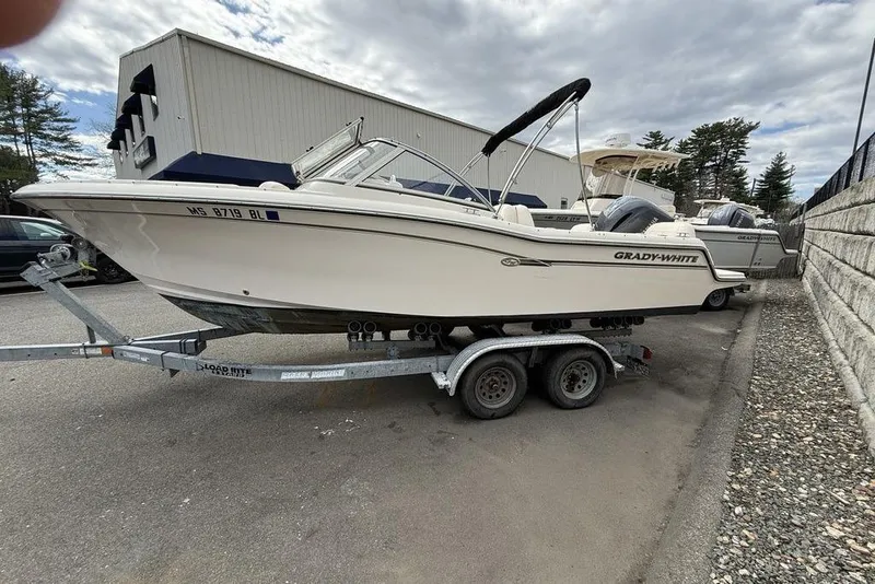 Slide: The Image of 2019 Grady-White Freedom 215 boat on trailer, parked outdoors. - 4