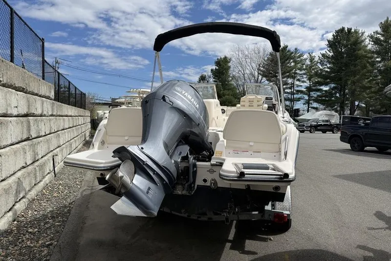 Slide: The Image of 2019 Grady-White Freedom 215 boat with Yamaha outboard motor, parked outdoors. - 5