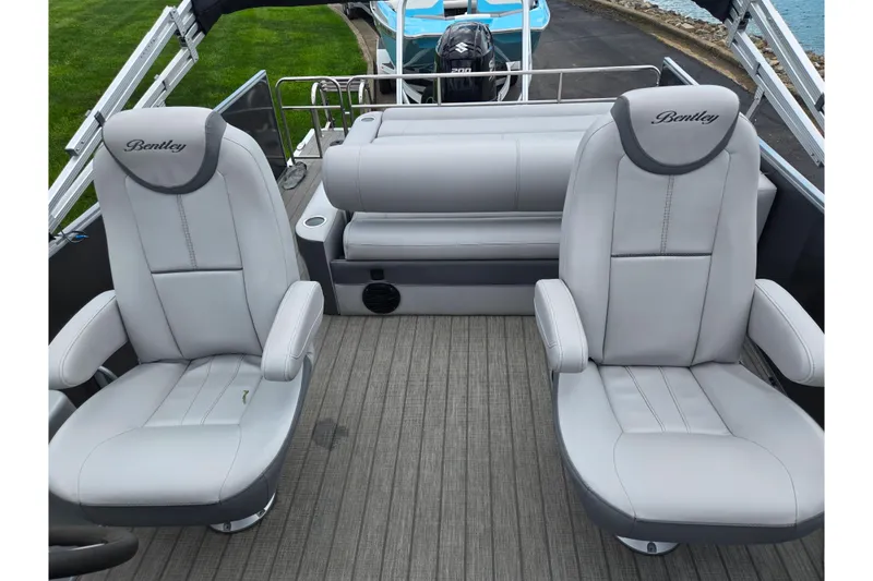 Slide: The Image of 2020 Bentley Pontoons 220 Elite Swingback Dual Captain seats, luxurious gray interior. - 16