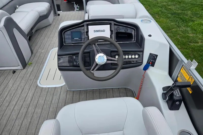 Slide: The Image of 2020 Bentley Pontoons 220 Elite Swingback Dual Captain helm with steering wheel and controls. - 22