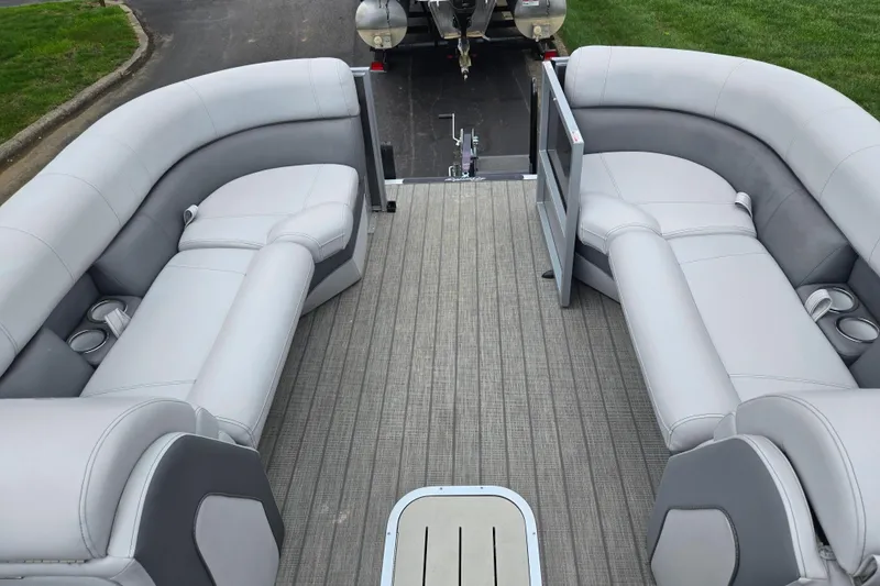 Slide: The Image of 2020 Bentley Pontoons 220 Elite Swingback Dual Captain interior with plush seating and cup holders. - 25