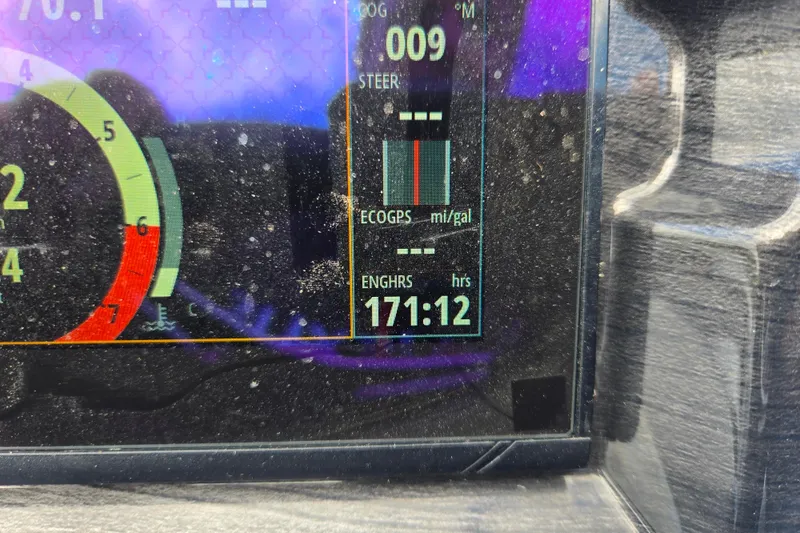 Slide: The Image of Dashboard of 2020 Bentley Pontoons 220 Elite, showing engine hours and eco performance. - 26