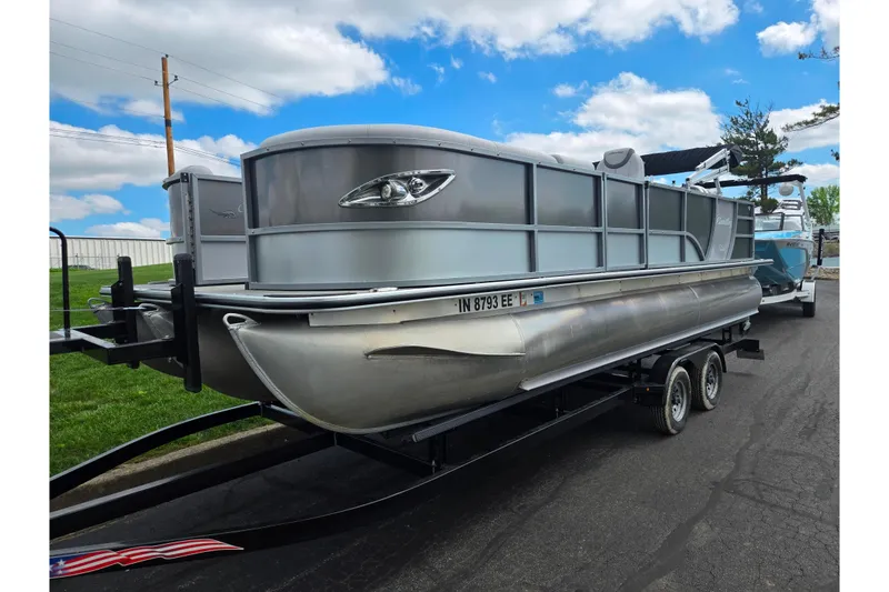 Slide: The Image of 2020 Bentley Pontoons 220 Elite Swingback Dual Captain on trailer, under blue sky. - 5