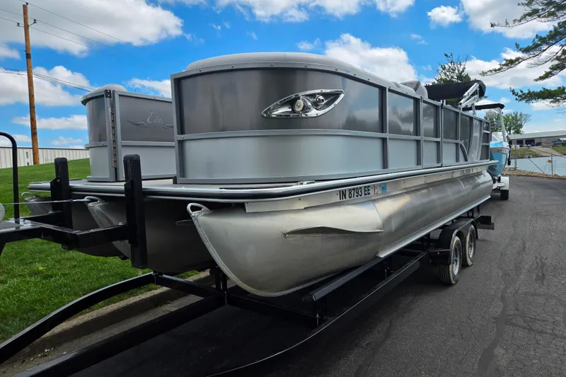 Slide: The Image of 2020 Bentley Pontoons 220 Elite Swingback Dual Captain on trailer, parked outdoors. - 6