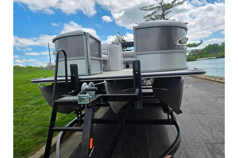Slide: The Image of 2020 Bentley Pontoons 220 Elite Swingback Dual Captain on trailer by a lakeside. - 7
