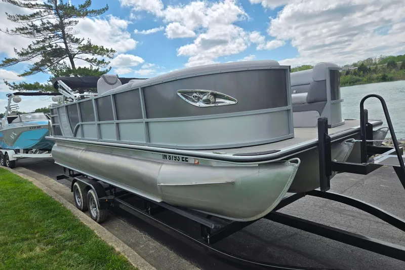 Slide: The Image of 2020 Bentley Pontoons 220 Elite Swingback Dual Captain on trailer by a lakeside. - 9