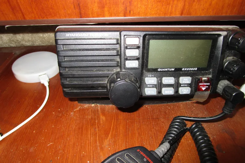 Slide: The Image of Marine radio equipment on 1984 Tollycraft 26 Sedan boat, featuring Quantum GX2360S model. - 12