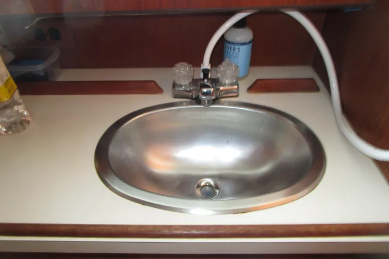 Slide: The Image of Stainless steel sink in 1984 Tollycraft 26 Sedan boat interior. - 17