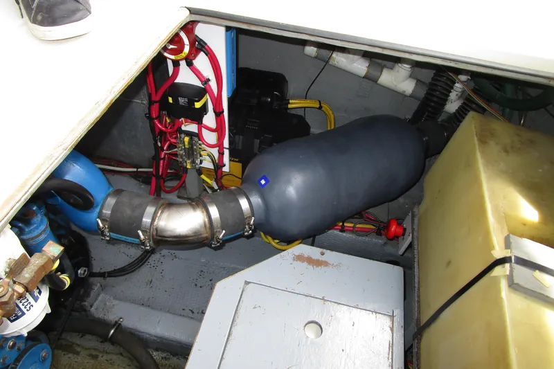 Slide: The Image of Engine compartment of a 1984 Tollycraft 26 Sedan boat, showing wiring and components. - 31