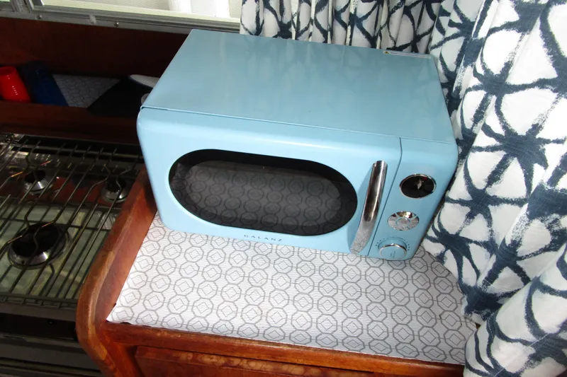Slide: The Image of Retro blue microwave in 1984 Tollycraft 26 Sedan boat interior. - 5