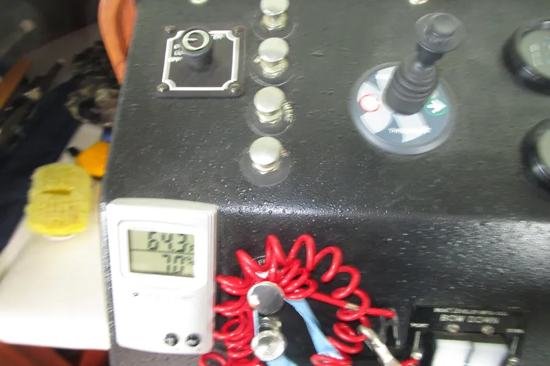 Slide: The Image of Control panel of a 1984 Tollycraft 26 Sedan boat with digital display and switches. - 9