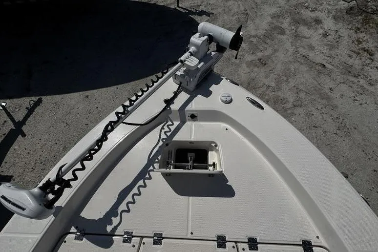 Slide: The Image of Bow of 2018 Robalo 226 Cayman boat with trolling motor and storage compartment. - 11