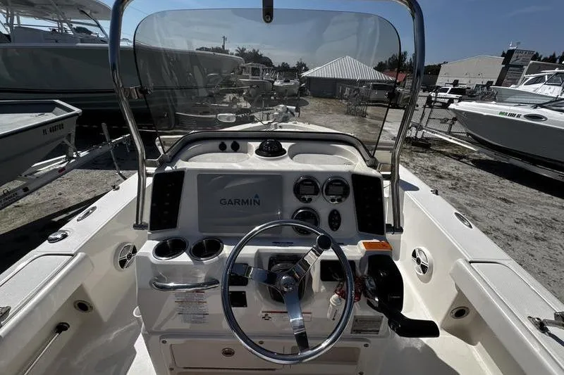 Slide: The Image of 2018 Robalo 226 Cayman boat dashboard with Garmin navigation system and steering wheel. - 14