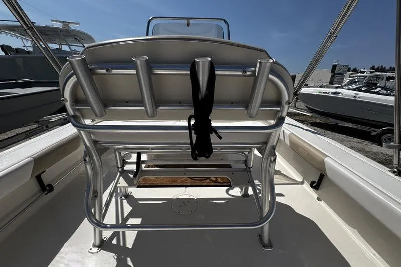 Slide: The Image of 2018 Robalo 226 Cayman boat interior with rod holders and seating. - 21