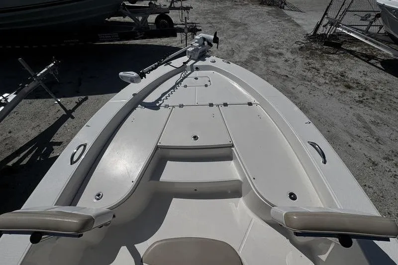 Slide: The Image of 2018 Robalo 226 Cayman boat deck with seating and storage compartments. - 7